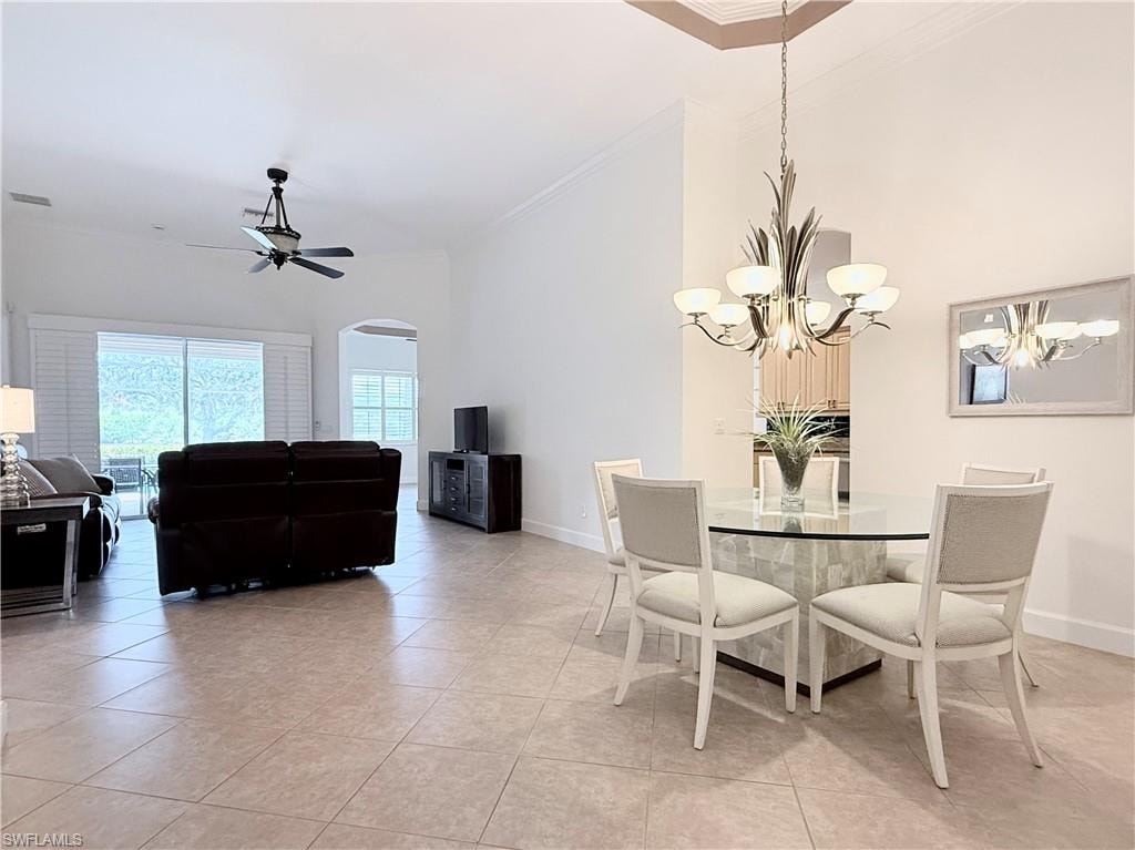 Open floor plan with high ceilings, tile floors throughout main living areas