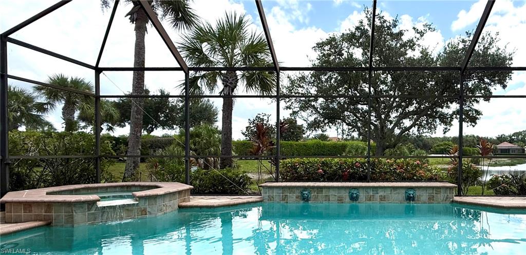 Beautiful pool/spa w/ soothing water feature, creating a private & inviting backyard retreat.