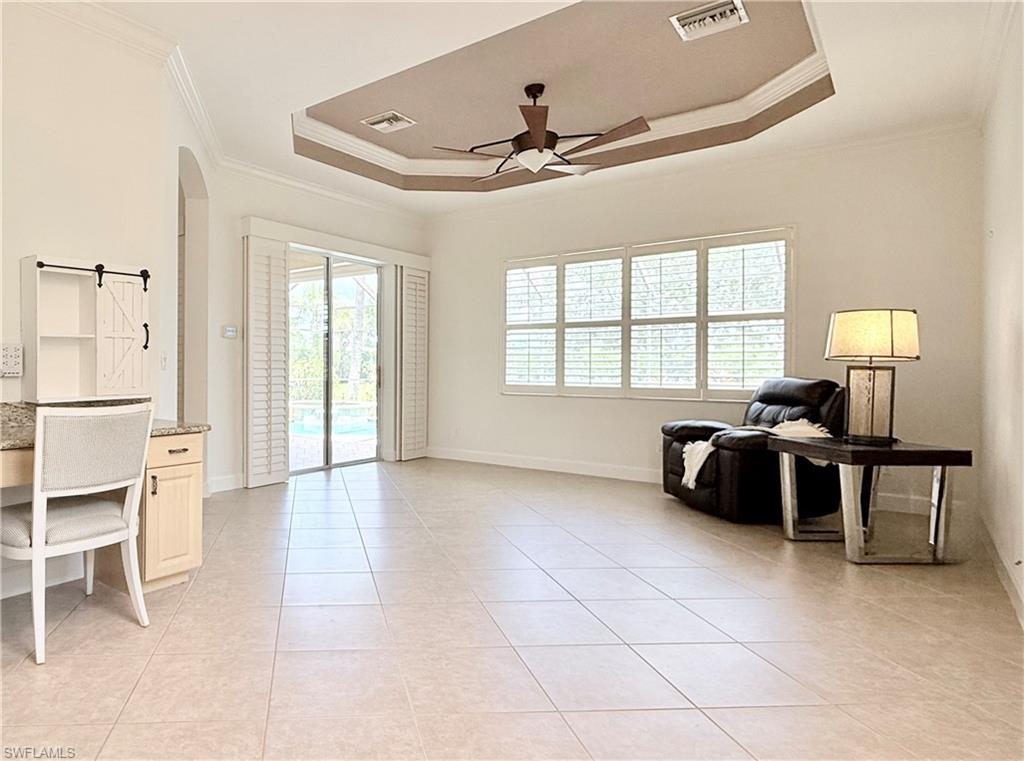 Built in desk w/ sliders out to covered lanai and pool