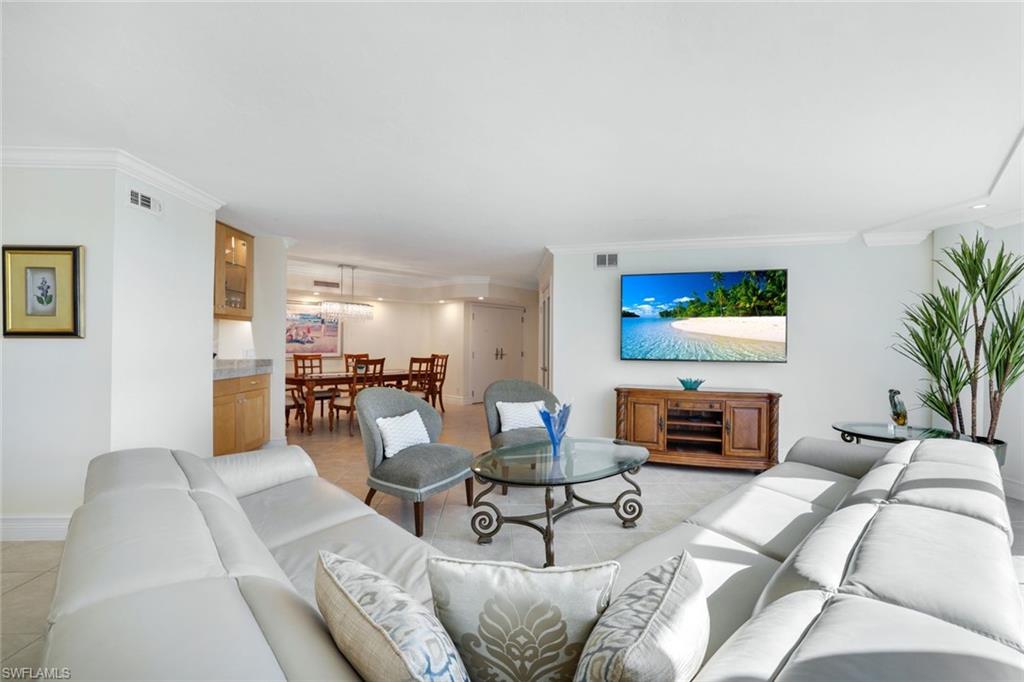 Tiled living room with crown molding