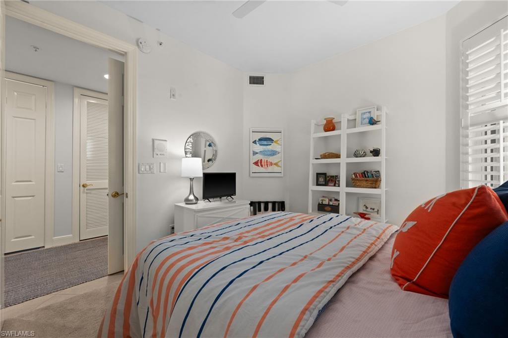 White interior walls with recessed lighting, ceiling fan, and wood-finish flooring