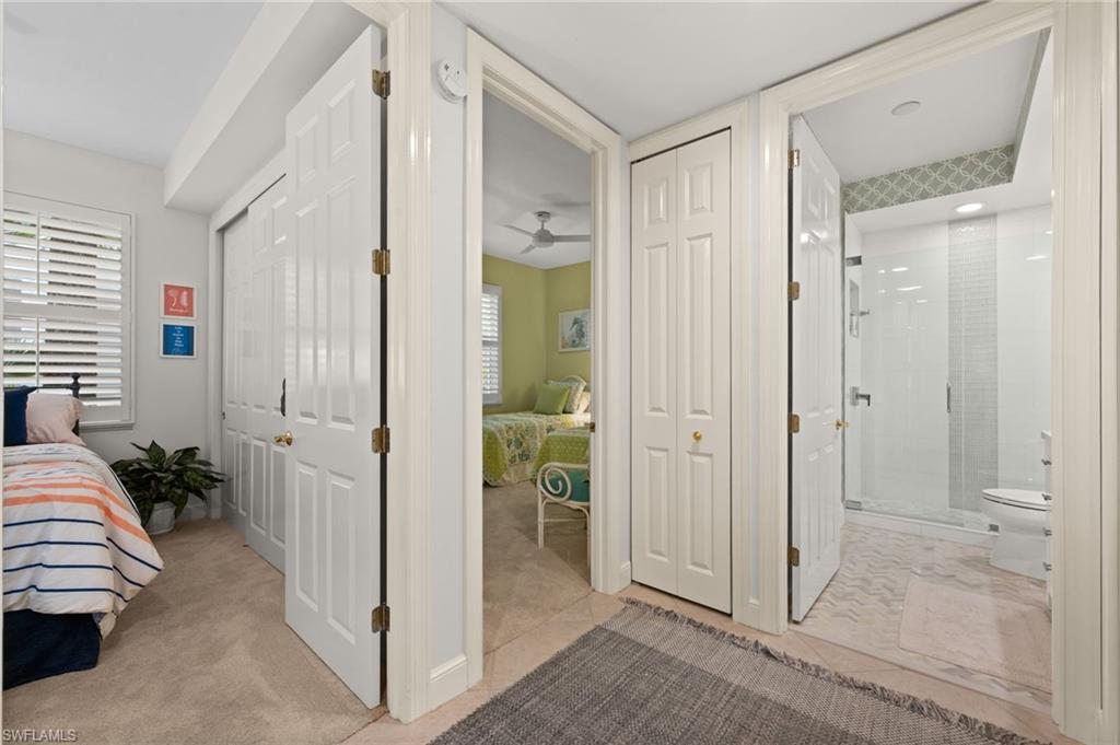 Guest wing with two bedrooms, bath, and storage