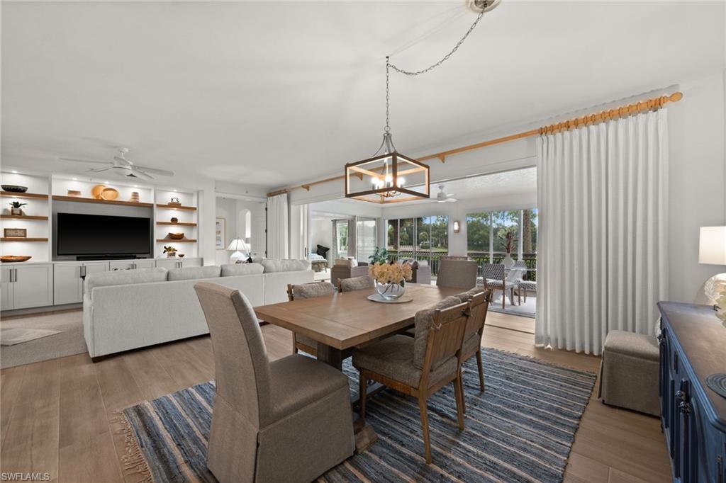 Open-concept living space with wood-finish flooring