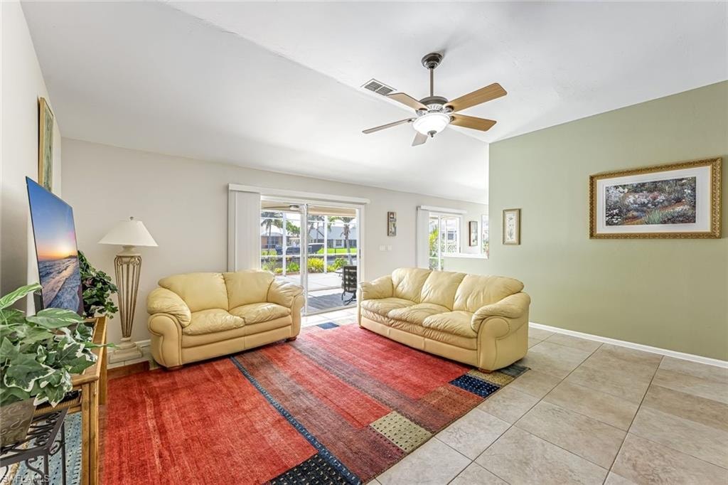 Great Room has lots of sunlight with slider to pool area.