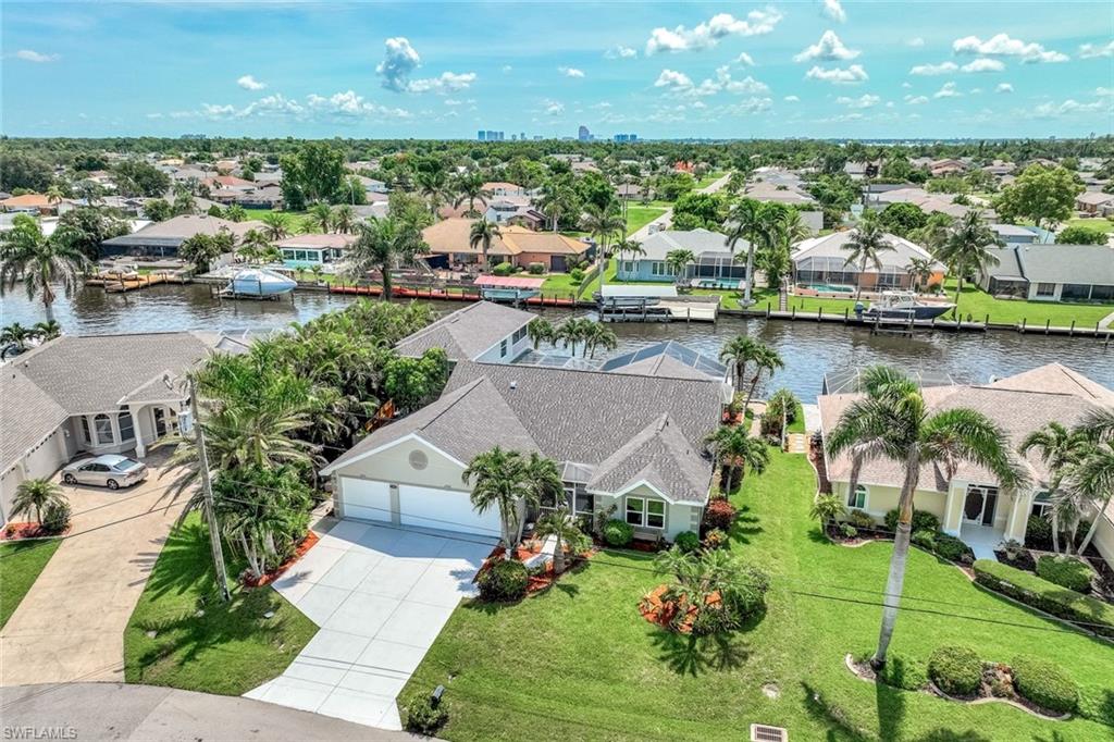 Aerial View of house with pool and 120' wide direct access canal.