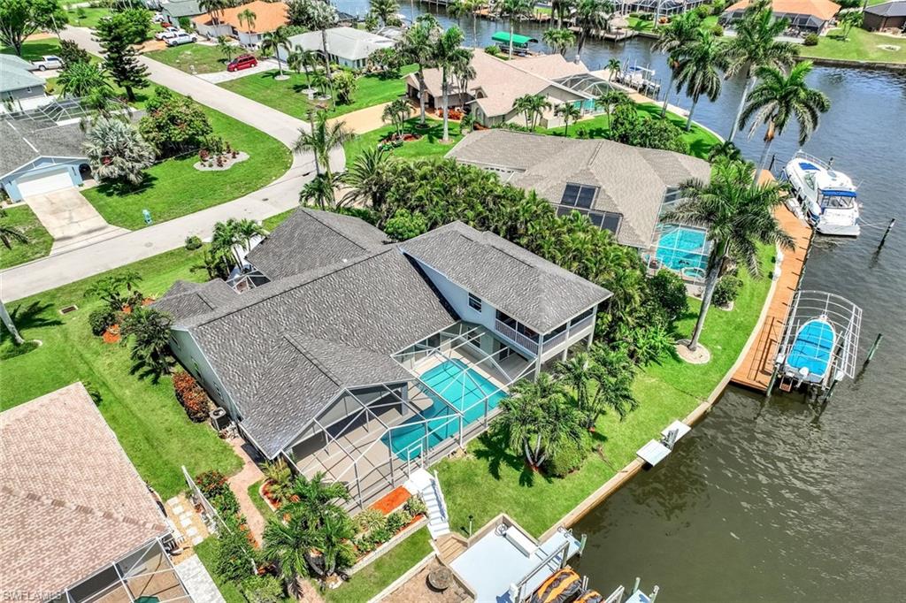 Aerial View of canal and rear of the house.