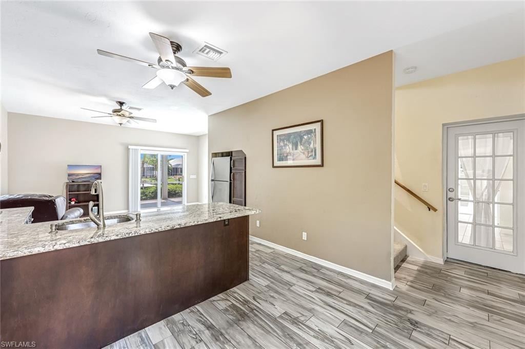 Attached Mother-In-Law Suite with Kitchen and French Doors to the main house.