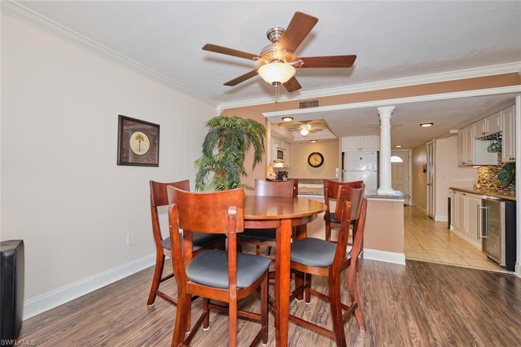 Wood-finish flooring, crown molding,  showing past furniture, unit will have similar type for rental