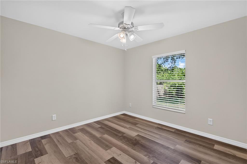Neutral-toned walls complement wood-finish flooring