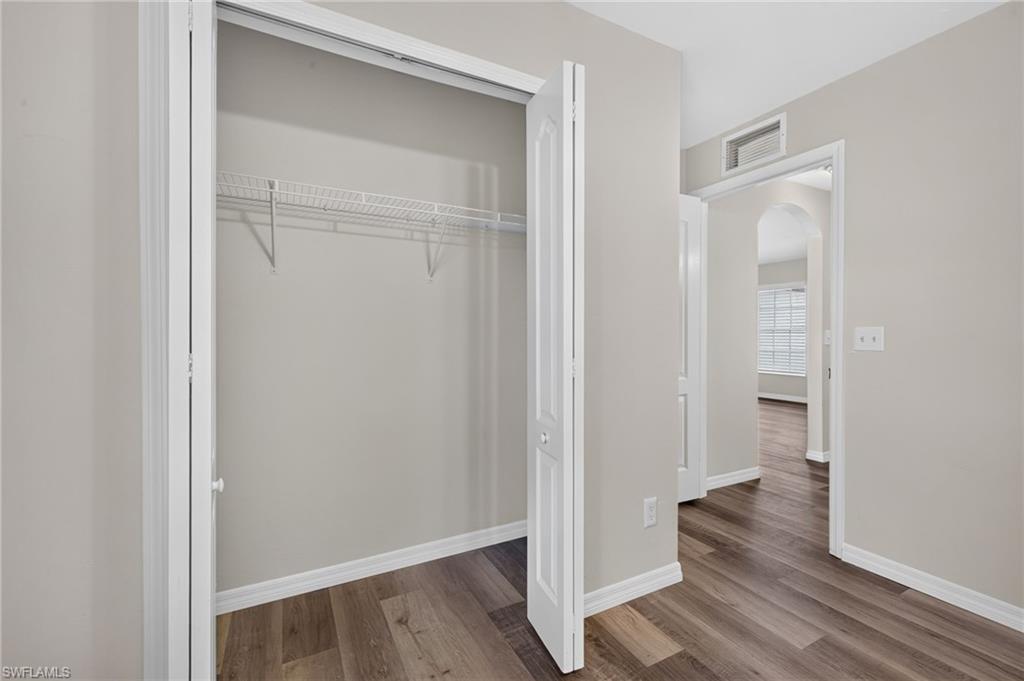 Wood-finish flooring throughout, with neutral wall paint