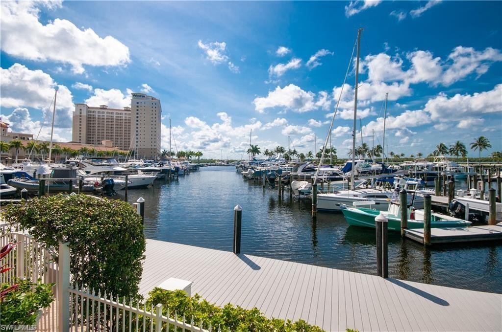 Dock area featuring a water view and view of marina