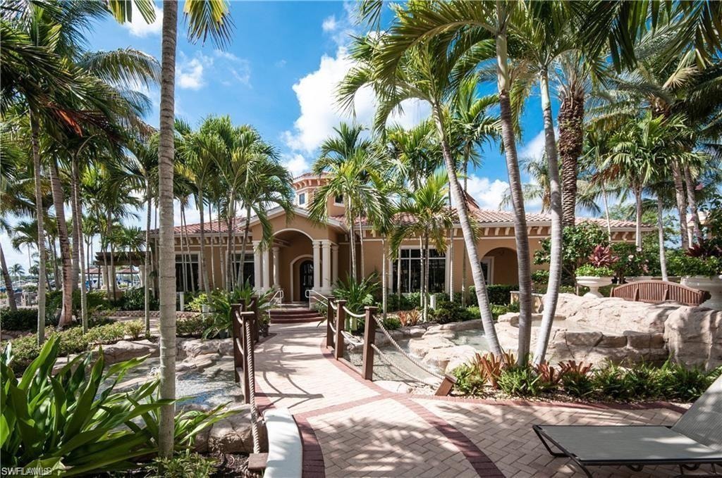 View of front of home featuring stucco siding and a tiled roof