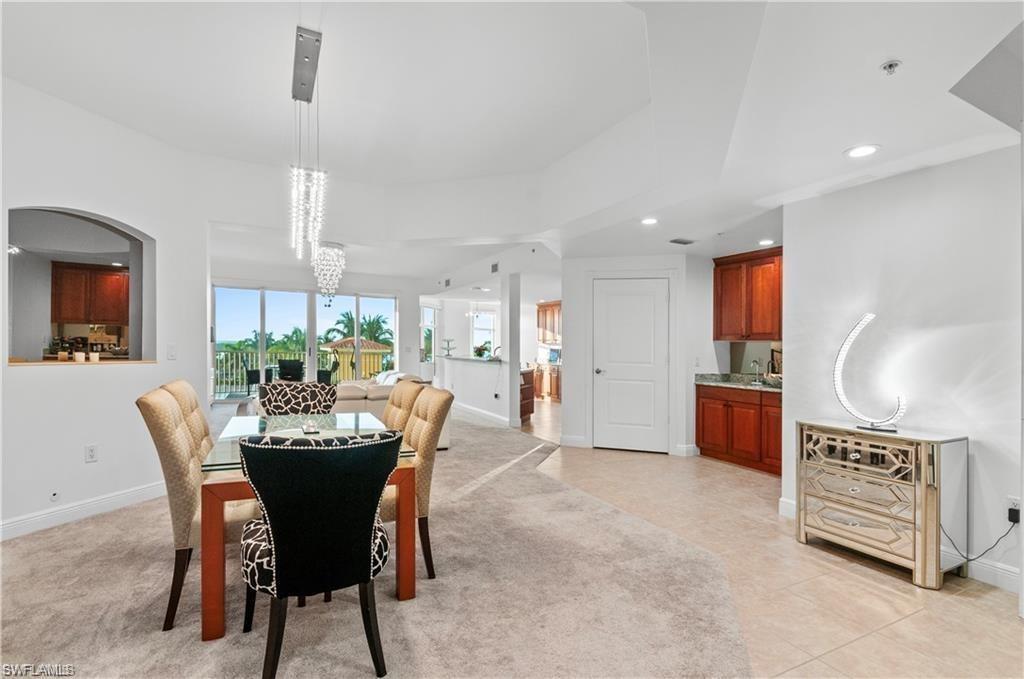 Dining room with recessed lighting and light tile patterned floors