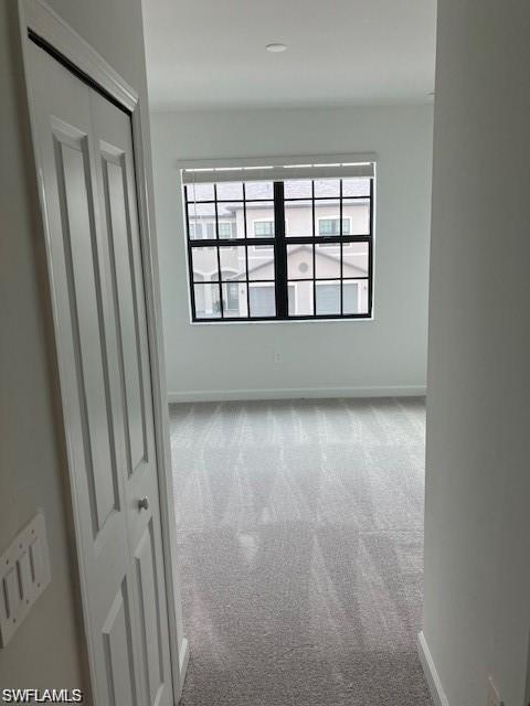 Empty room featuring carpet flooring