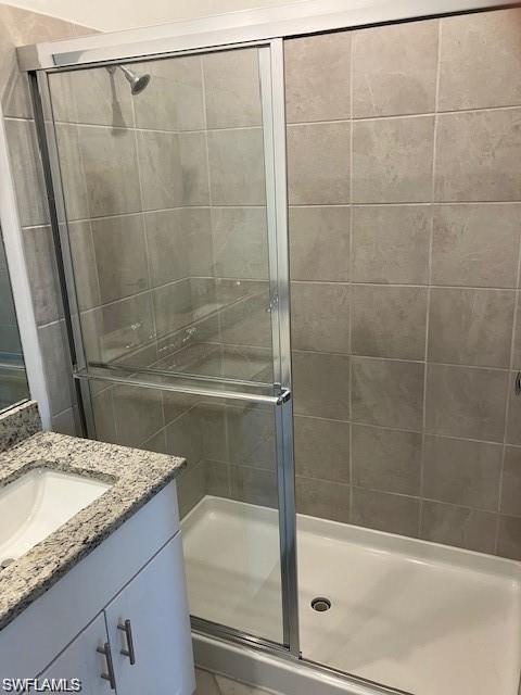 Bathroom featuring vanity and walk in shower
