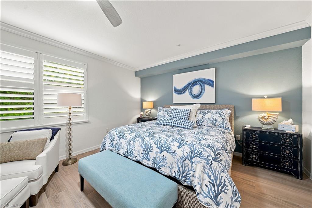 Recessed lighting, crown molding, plantation shutters, wood-finish flooring, and a ceiling fan