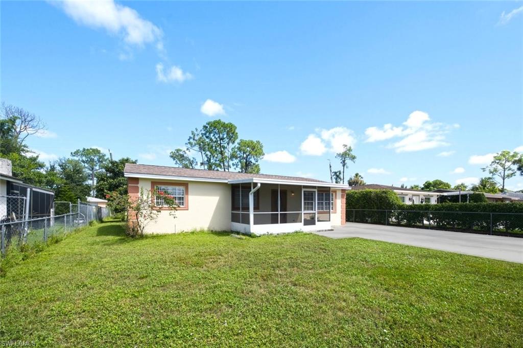 yard with front lanai and drive