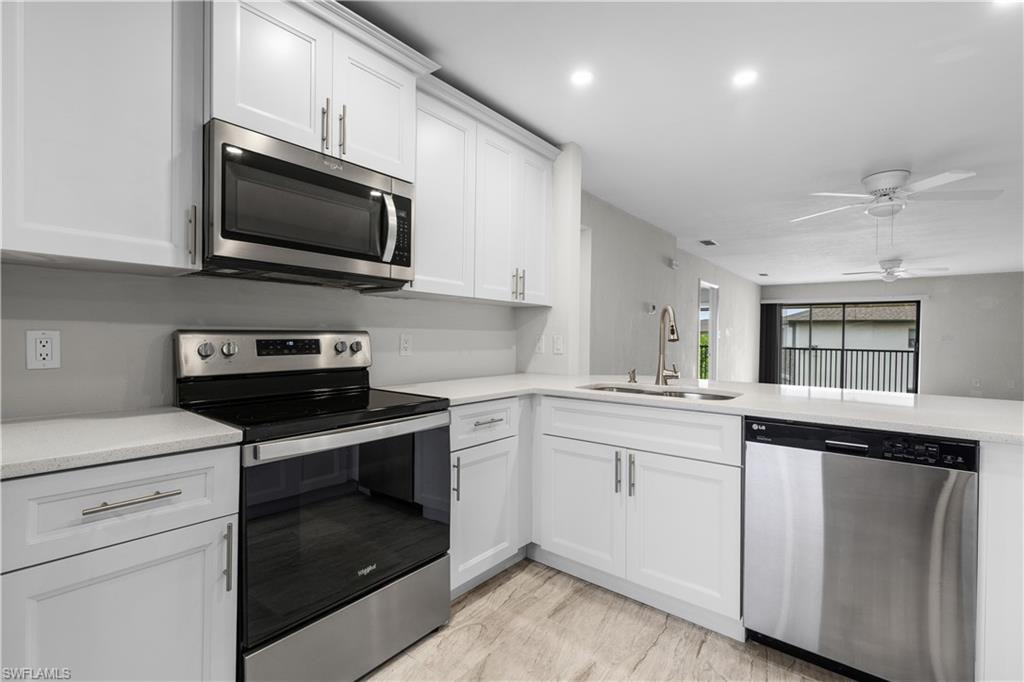 White shaker-style cabinetry with stainless steel hardware