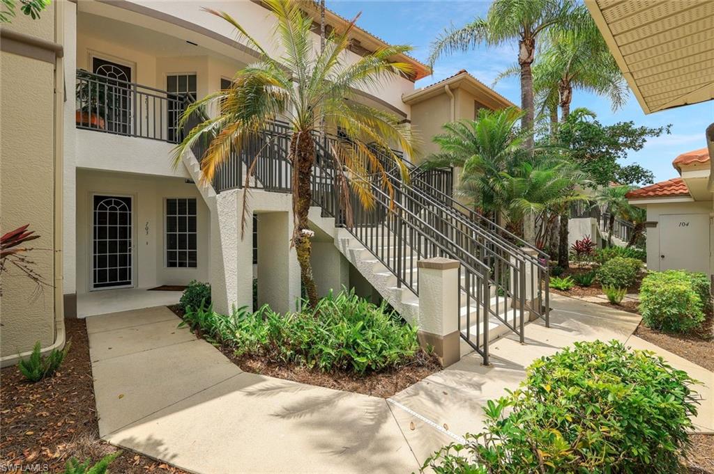 Doorway to property featuring stucco siding