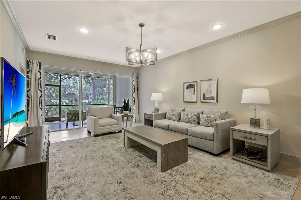Living area with crown molding, recessed lighting, an inviting chandelier, and light tile patterned flooring