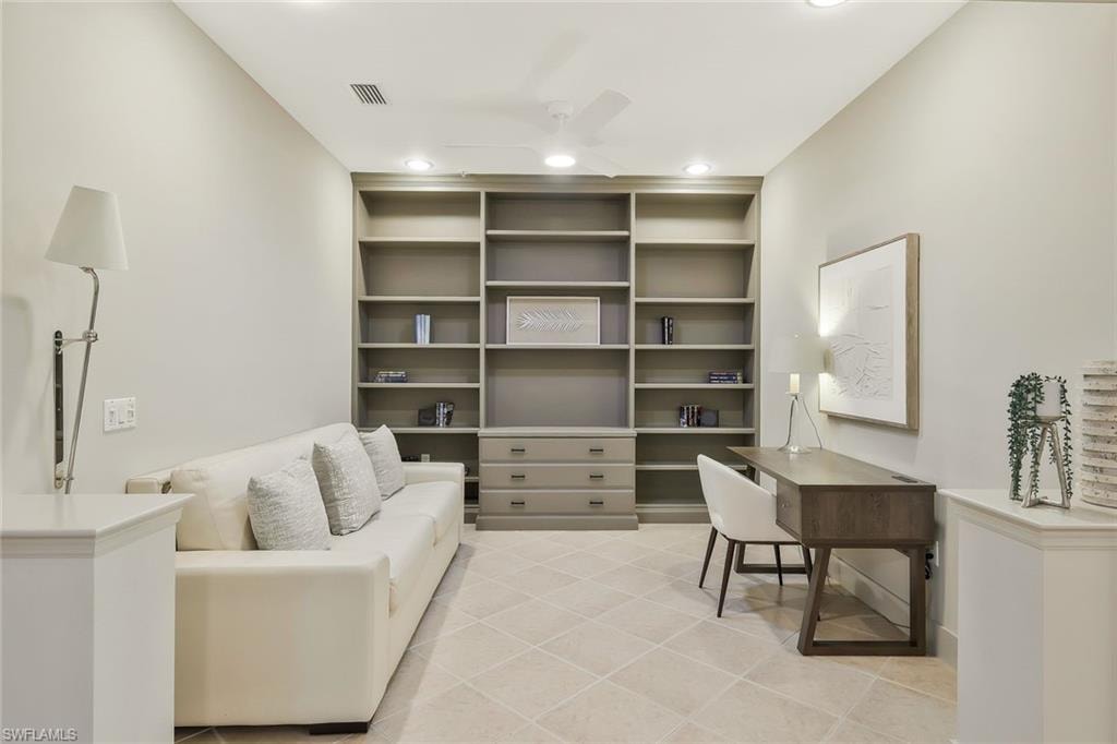 Home office featuring light tile patterned floors, a ceiling fan, visible vents, and recessed lighting