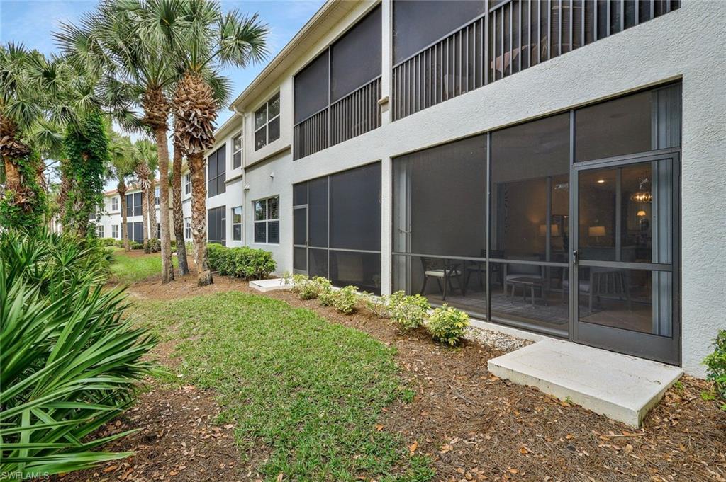 View of yard with a sunroom