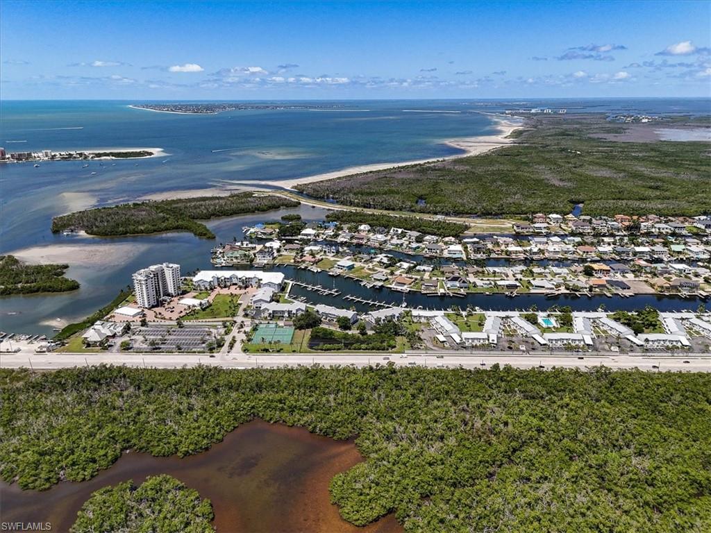 Waterfront community featuring multi-story buildings and single-family residences