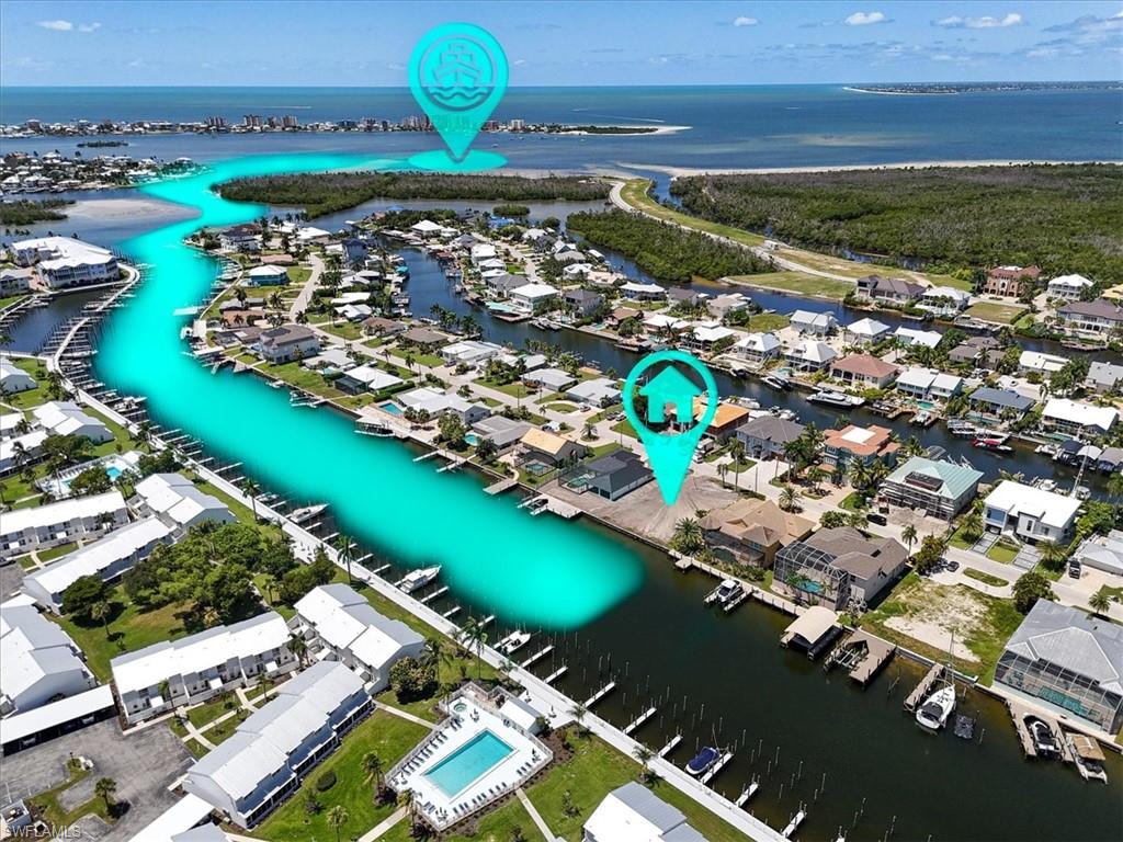 Waterfront property with direct canal access, private boat slips, and proximity to open water