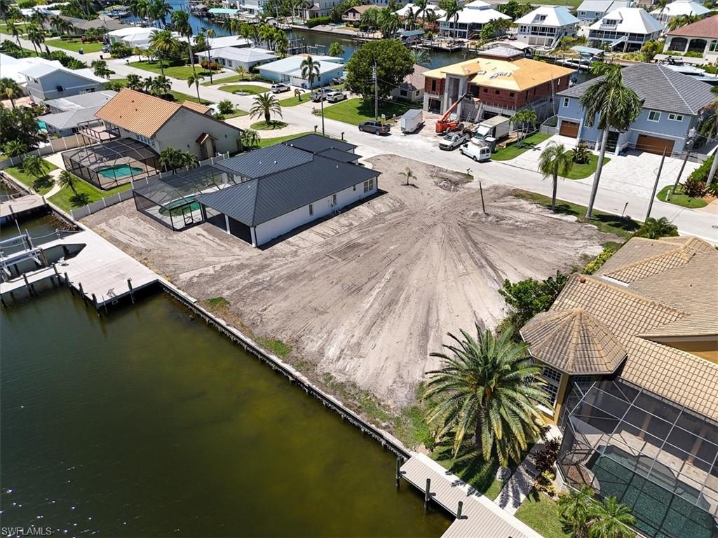 Vacant lot with existing seawall and private dock