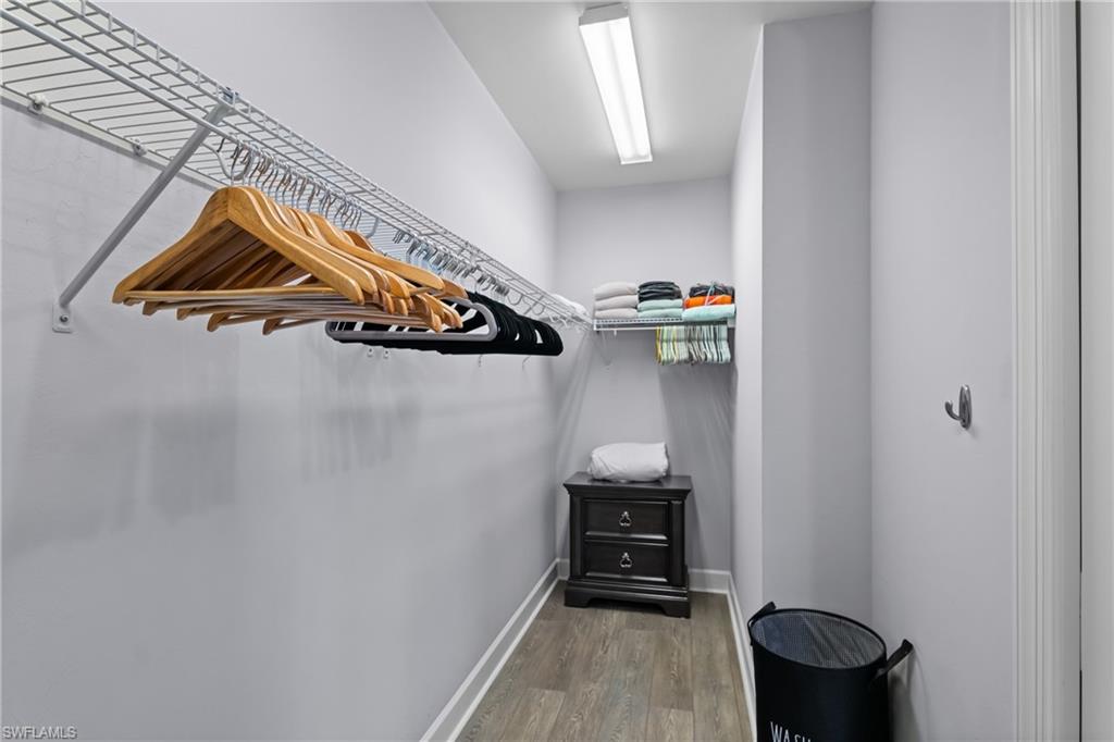 Recessed lighting, wire shelving system, wood-finish flooring