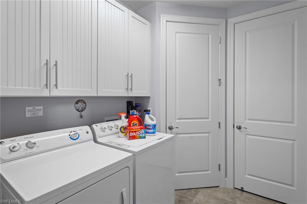 White beadboard cabinetry with brushed nickel hardware
