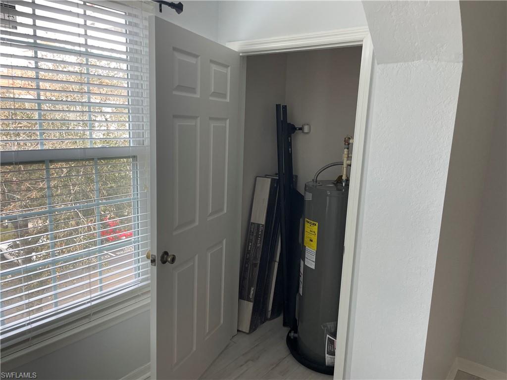 Utility room with electric water heater