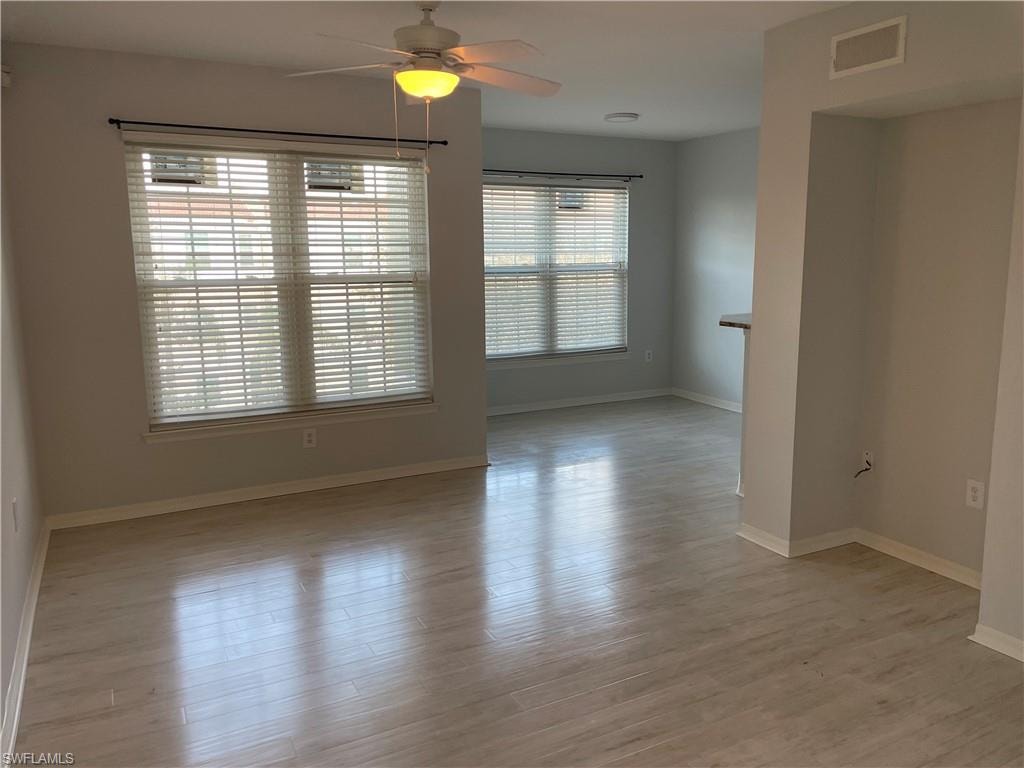 Empty room featuring light hardwood / wood-style floors and ceiling fan