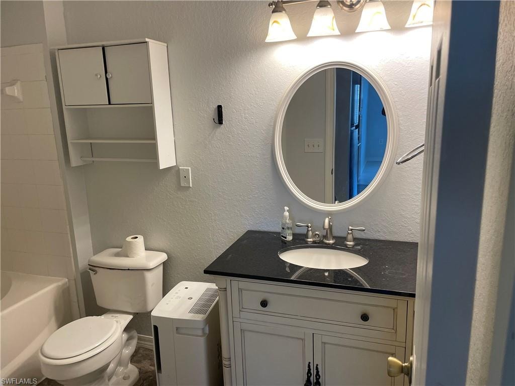 Bathroom with toilet and vanity