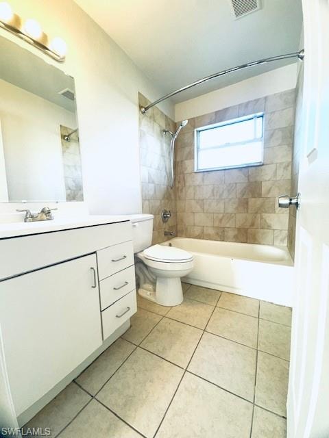 Spacious bathroom featuring a white vanity with ample storage, ceramic tile flooring, and a tub/shower combination with curved glass enclosure and natural window lighting