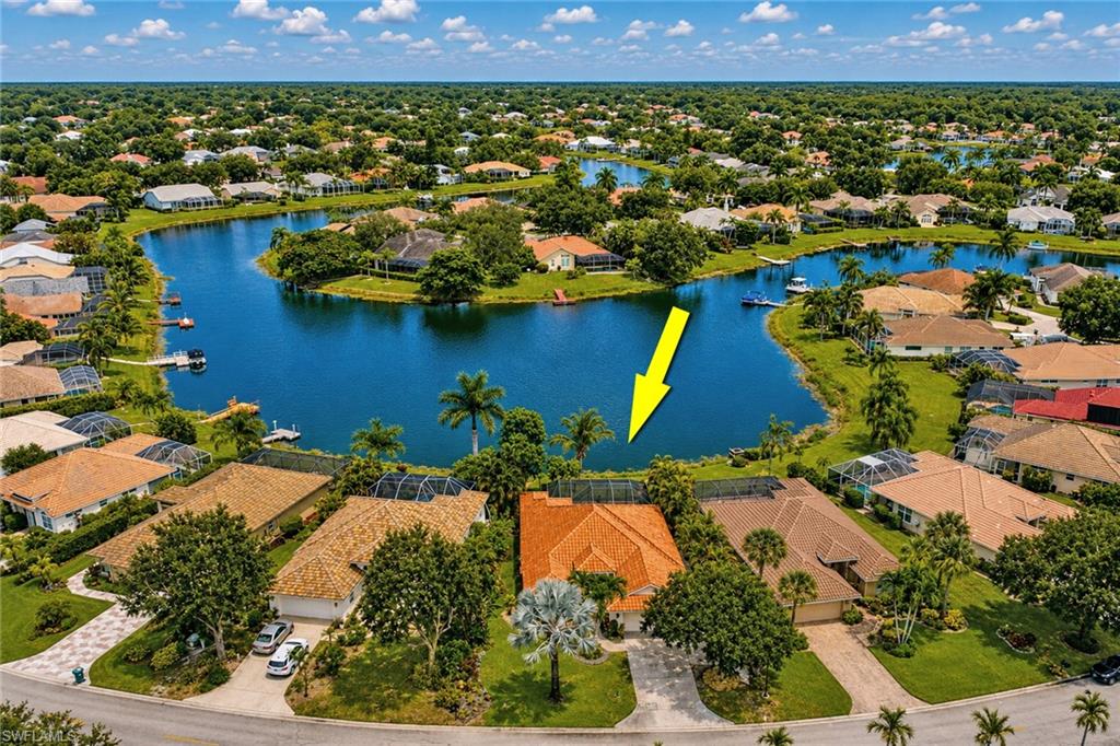 Waterfront property with mature landscaping and a private driveway