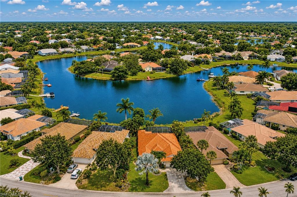 Residential area featuring extensive waterways, mature trees, and a mix of single-story homes