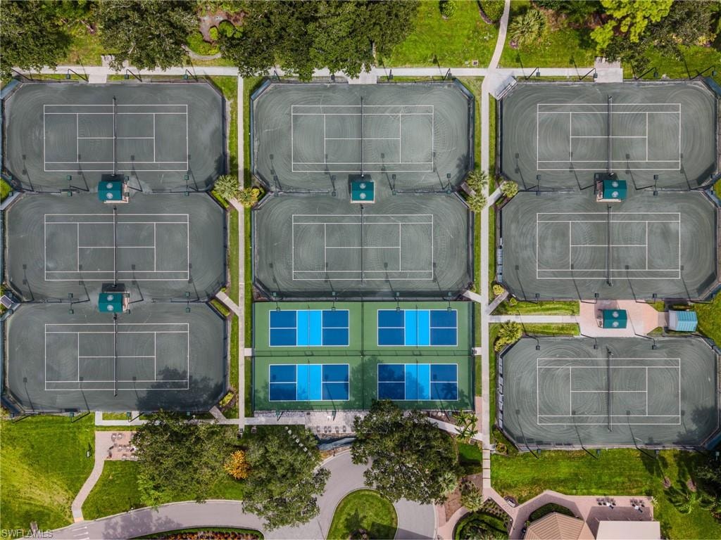 Eight tennis courts, four pickleball courts, manicured landscaping, and paved pathways