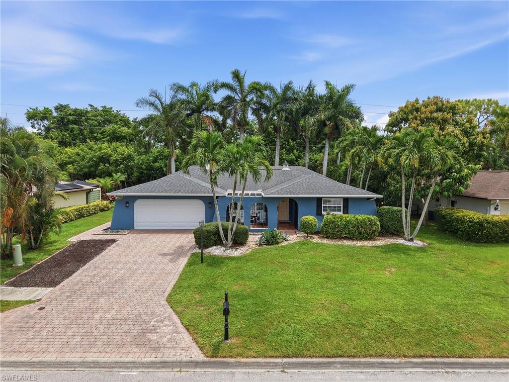 LONG PAVER DRIVE/MATURE TROPICAL VEGETATION...