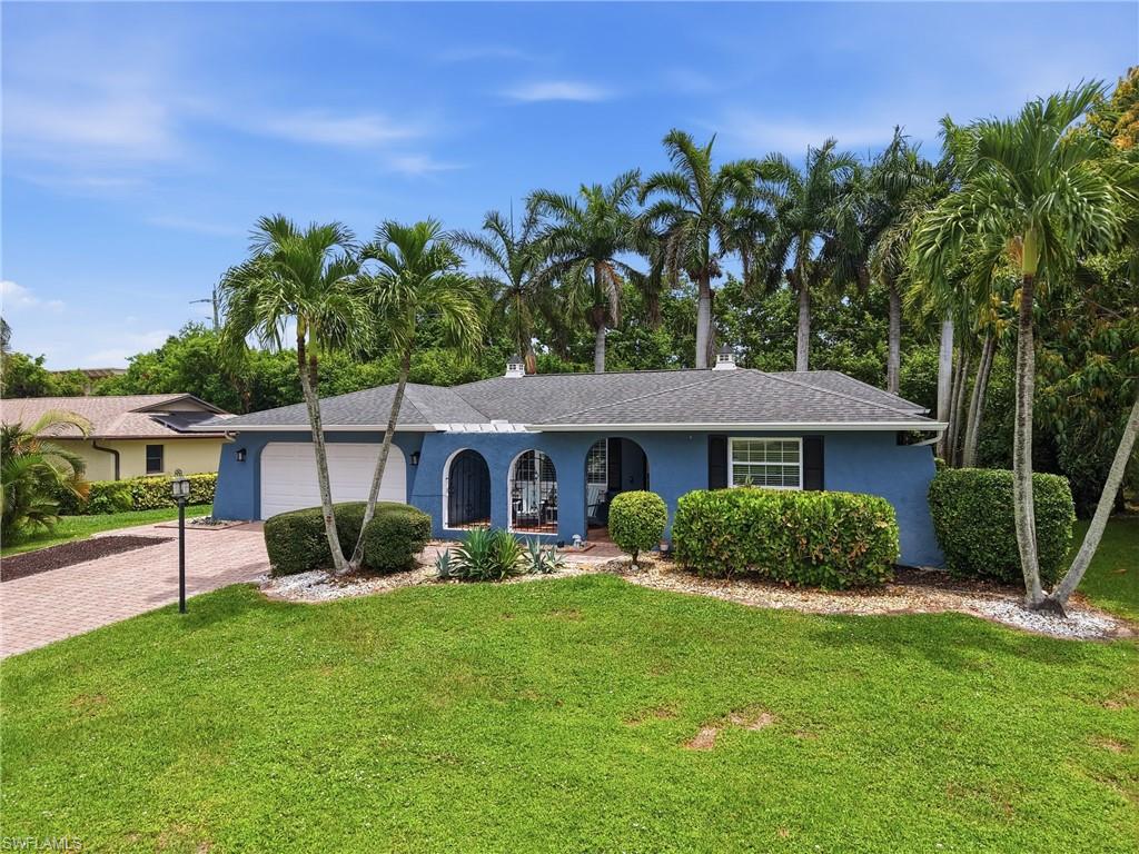 FRONT ELEVATION/LONG PAVER DRIVE/OPEN COURTYARD ENTRY...