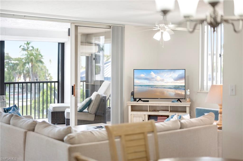 Living area with healthy amount of natural light and a ceiling fan