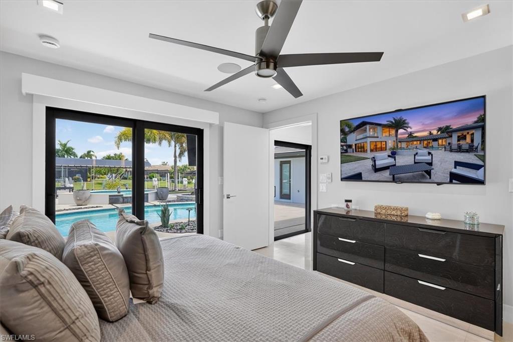 Primary lower level bedroom leading to pool area