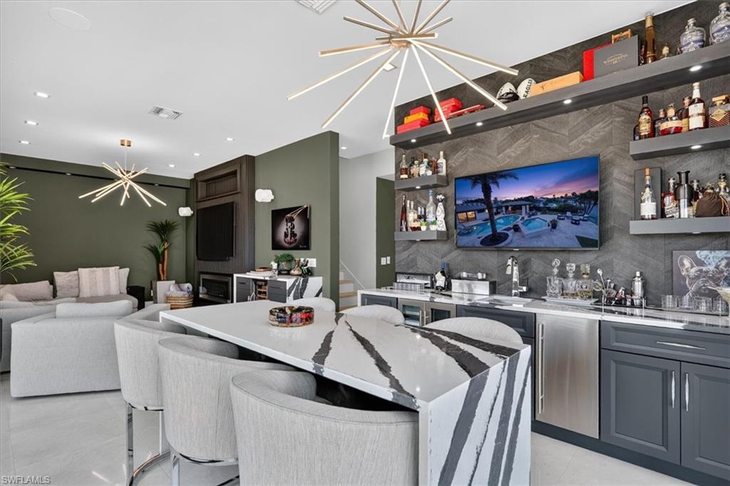 Dry bar with beverage fridge, wine cooler and storage