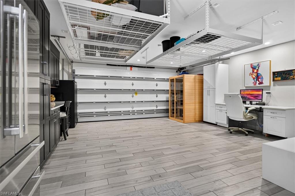 Has fridge, flooring and cabinetry.