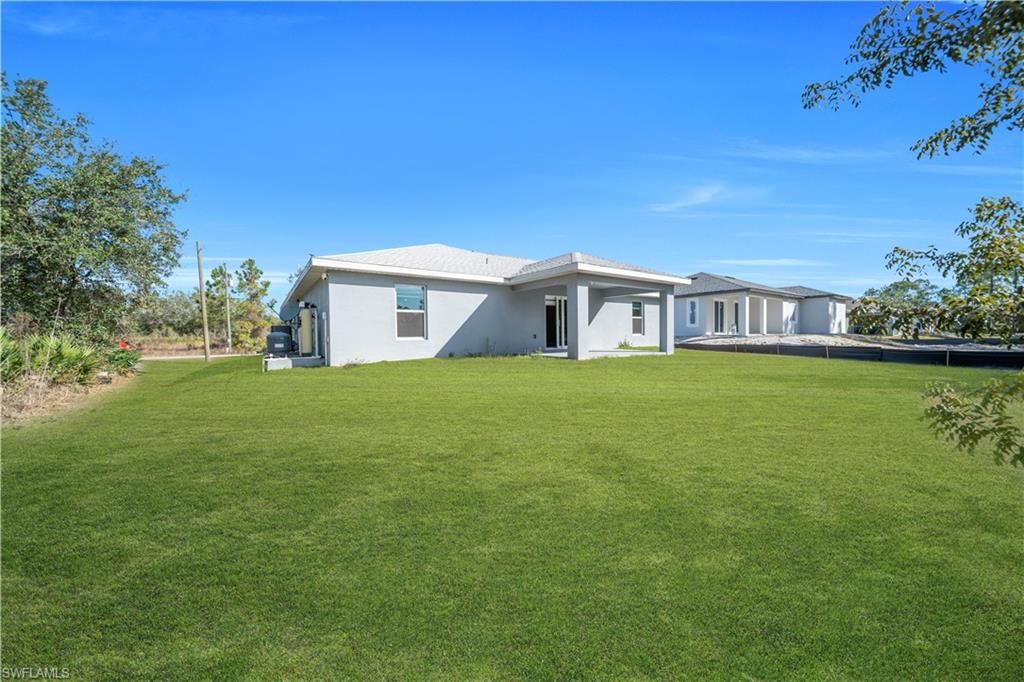 Expansive green lawn provides ample outdoor space