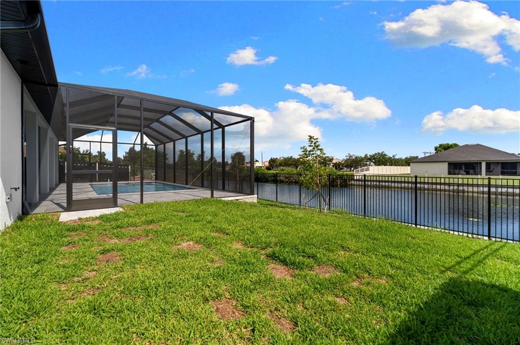 Screened-in pool enclosure with a concrete patio