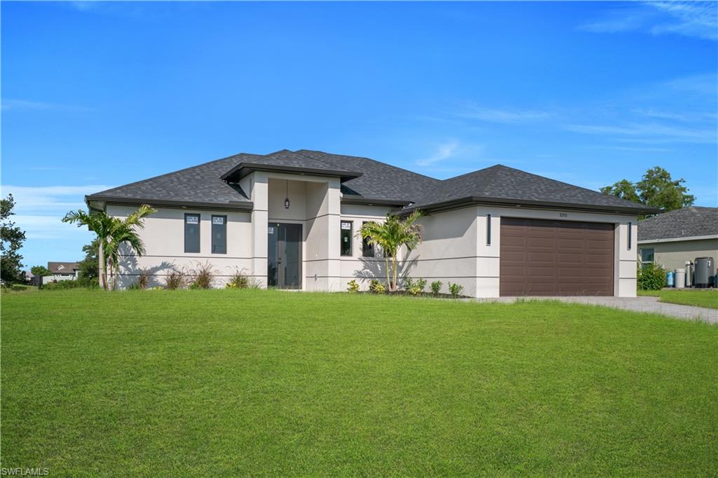Contemporary stucco exterior with a dark shingle roof, integrated two-car garage, and a concrete driveway