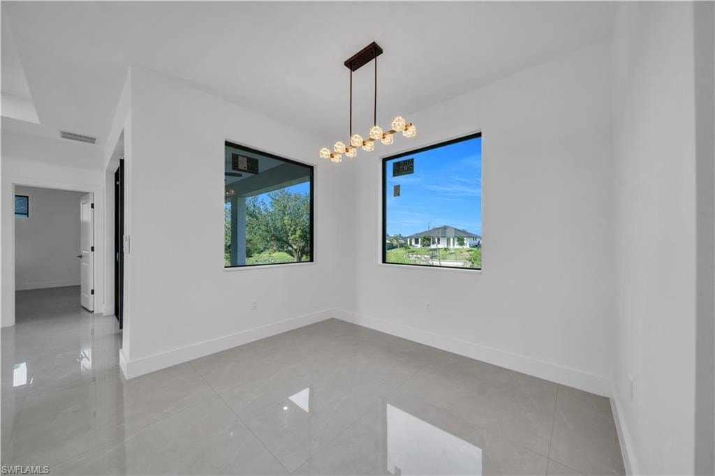 Recessed ceiling fan, light gray tile flooring, white walls, black-framed window
