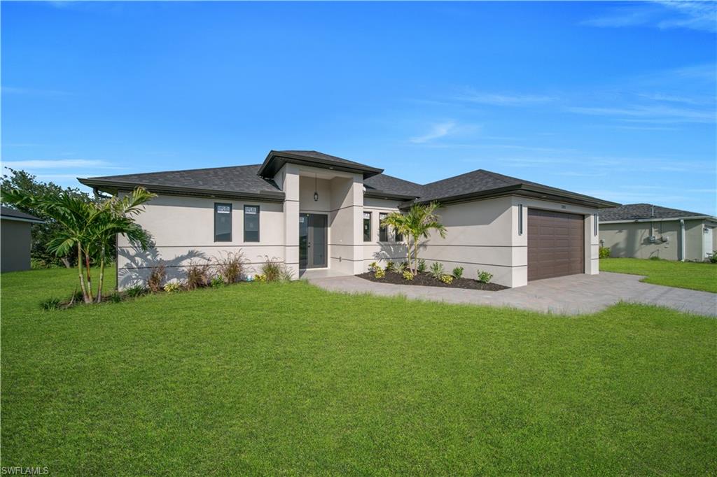 Contemporary exterior architecture with a dark shingle roof and light-toned stucco