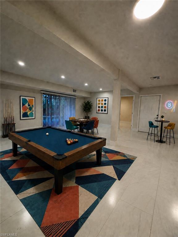 Downstairs game area virtually staged